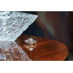 Ring with oval diamond and diamonds