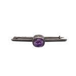 Silver brooch with an amethyst