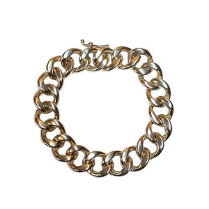 A gold-colored bracelet with a thick weave