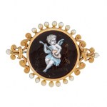 Brooch with depiction of an angel playing a lute, France, late 19th century.