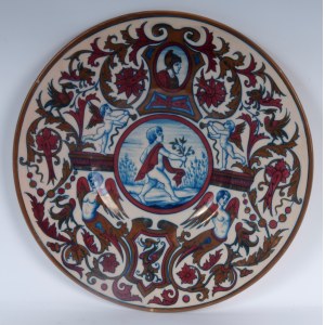 PAOLO RUBBOLI (attribuito a) (1838 - 1890) Polychrome ceramic pomp plate last quarter of the 19th century