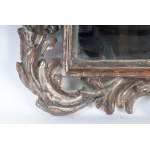 Wall mirror in silver-plated and carved wood 20th century