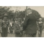 [Photograph] Presentation of the Pomeranian Scouting and Guiding Association (ZHP) flag by the national starost Wincenty Lacki to the former commander of the Scouting and Guiding Association, Wilhelm Slabe [1932].