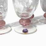 Serving of colorless and pink Murano glass glasses