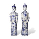 Pair of oriental figures in white and blue porcelain