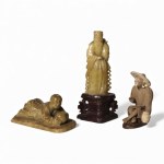 Group of three oriental figures in carved stone