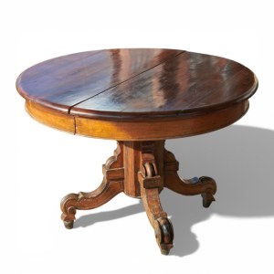 Extendable round walnut dining table