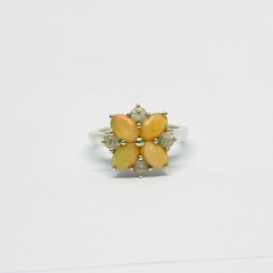 Silver ring in the form of a flower with Opals and white Sapphires