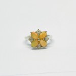 Silver ring in the form of a flower with Opals and white Sapphires