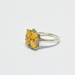 Silver ring in the form of a flower with Opals and white Sapphires
