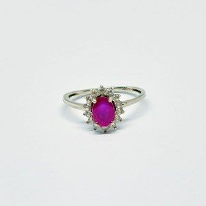 Silver ring with natural Ruby and white Topazes