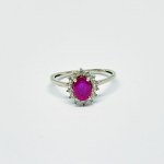 Silver ring with natural Ruby and white Topazes