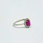 Silver ring with natural Ruby and white Topazes