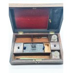 Antique Victorian travel desk with two inkwells and pen