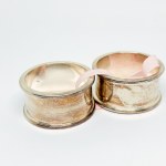 Two silver-plated napkin holders