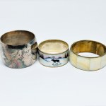 Three silver-plated napkins