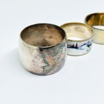 Three silver-plated napkins