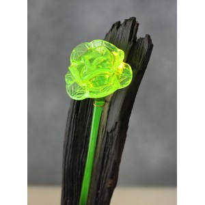 Decorative form - Uranium glass rose on a background of black oak