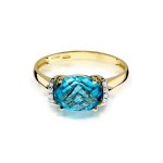 Gold ring with diamond and topaz