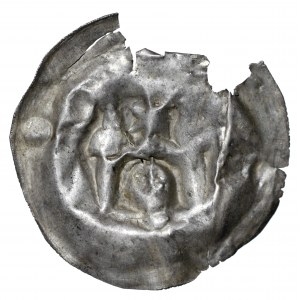 Brakteat, II połowa XII wieku, głowa pod łukiem, gwiazda