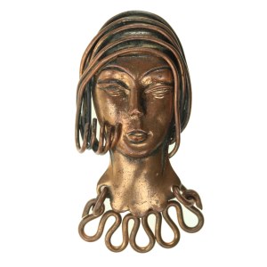 Brooch of a woman's head, model in the style of Joseph Fajngold. Copper (144)