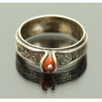 Silver ring with coral, author