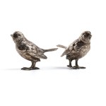 A pair of solid silver birds