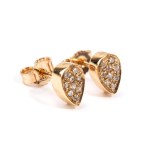 A pair of geometric gold and diamond earrings