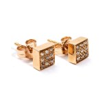 A pair of geometric gold and diamond earrings