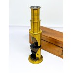 Antique brass field microscope in box, circa 1910