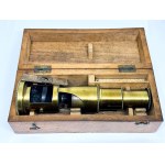 Antique brass field microscope in box, circa 1910