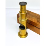 Antique brass field microscope in box, circa 1910