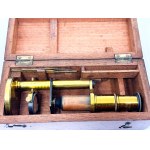 Antique travel microscope with tweezers in a box