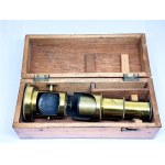 Antique brass field microscope in box, circa 1910