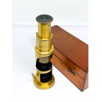 Antique brass field microscope in box, circa 1910