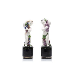 PAIR OF FAIENCE FIGURES - ALLEGORIES OF SPRING AND AUTUMN (PUTTI) | (AUSTRIA-HUNGARY / AUSTRO-HUNGARIAN)