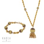Gold jewelry set: sautoir necklace with clasp and bracelet, late 19th century.