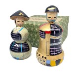 Pair of kokeshi in original box from the "History of Clothing" series, Sengoku era clothing