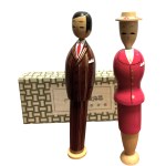 Pair of kokeshi in original box from "Clothing History" series, Showa era clothing