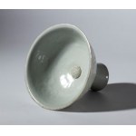 A Qingbai ceramic stemmed cup decorated with a floral motif and a celadon glaze. China, Song Dynasty (960-1269).