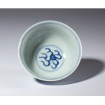 A small blue-painted porcelain bowl depicting dragons among clouds. China, Republic period (1912-1949).