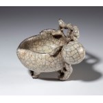A crackled-glaze ceramic bowl in the shape of a fruit. China, 20th century.