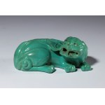 A jade-green glazed porcelain figurine depicting a mythical beast. China, 20th century.