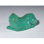 A jade-green glazed porcelain figurine depicting a mythical beast. China, 20th century.