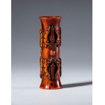 A tubular bone pendant carved with vajra-shaped elements. Tibet, 19th century