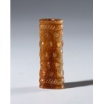 Ornamental tubular pendant in Hotan jade with rice grain decoration. China, Ming dynasty (1368-1644), 16th century.