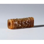 Ornamental tubular pendant in Hotan jade with rice grain decoration. China, Ming dynasty (1368-1644), 16th century.