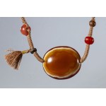 Necklace with orange-white zoned agate Lukmik pearl , with carnelian, wood, bone, and silver beads. Tibet, 18th century.