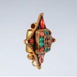 A Gau amulet holder made of gilded copper and semiprecious stones. Tibet, 19th century