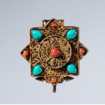 A Gau amulet holder in gilded silver and semiprecious stones. Tibet, 19th century